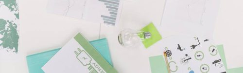 elevated-view-of-graph-with-natural-resources-icon-over-desk elevated-view-of-graph-with-natural-resources-icon-over-desk